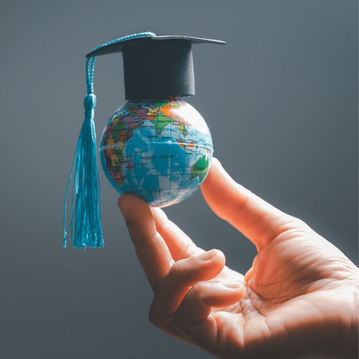 Graduation cap on a globe representing international education